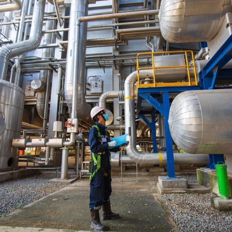 Man inspecting the water tank — Pure Aquatics in Waychioe, NSW