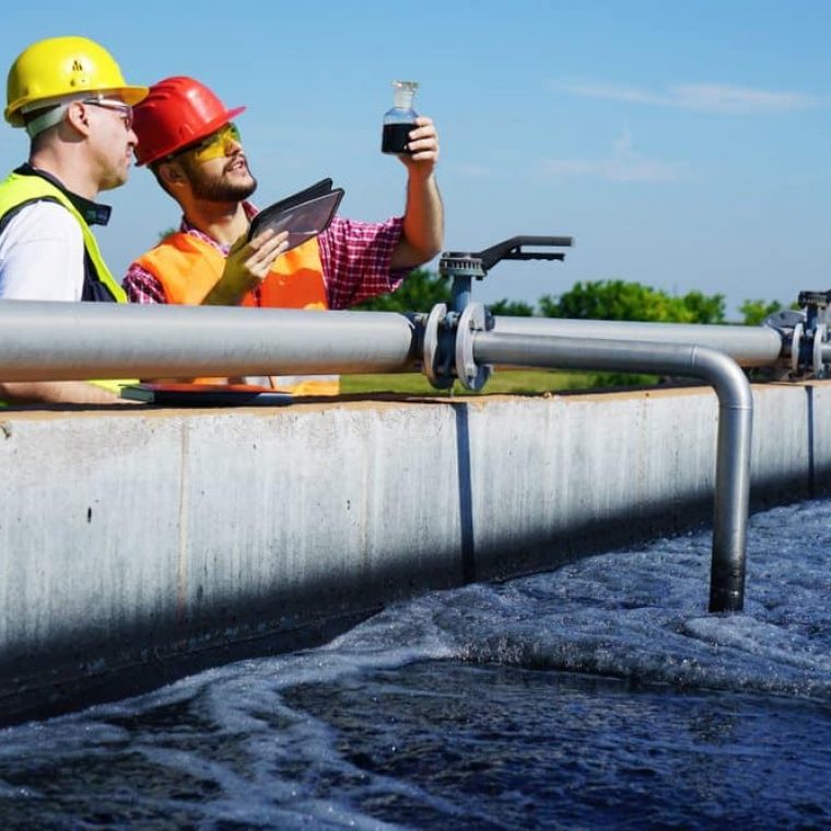 Two men checking water — Pure Aquatics in Waychioe, NSW