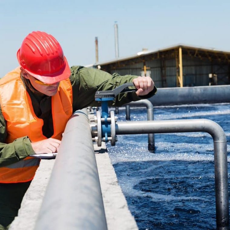 Man fixing Cleaning Water — Pure Aquatics in Waychioe, NSW